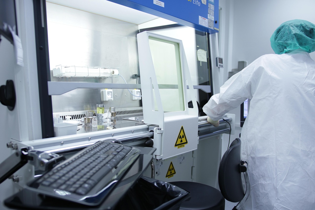 Photograph of pharmaceutical equipment and a lab worker