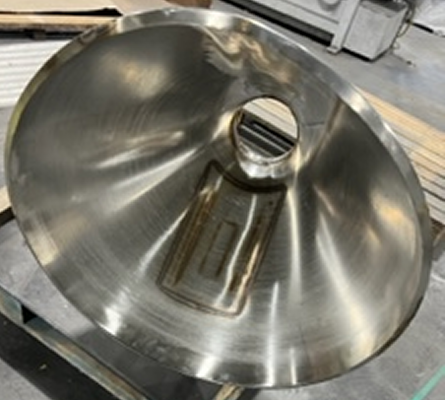 A piece of metal work before polishing, with dim/dark surfaces