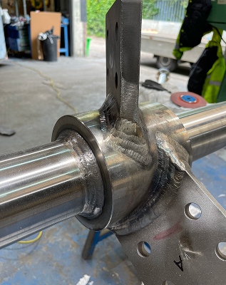 A piece of metal work before polishing, with dim/dark surfaces
